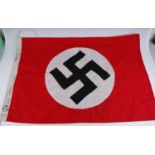 A reproduction German NSDAP flag, having a double sided white cotton panel with stitched swastika