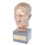 A bronze alloy bust of Adolf Hitler, on a marble plinth with title plaque, h.17cm, together with a