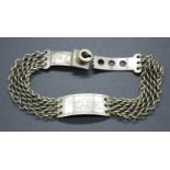 A 19th century identity bracelet, the central curved white metal disc engraved Capt. Spence 60th