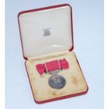 An E.R. II British Empire Medal, naming MISS LYDIA O. THOMAS, in Royal Mint red leather case of
