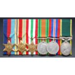 A group of six medals to include 1939-1945 Star, Africa Star, Italy Star, Defence, War and