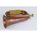 An early 20th century copper and brass bugle, 27cm.