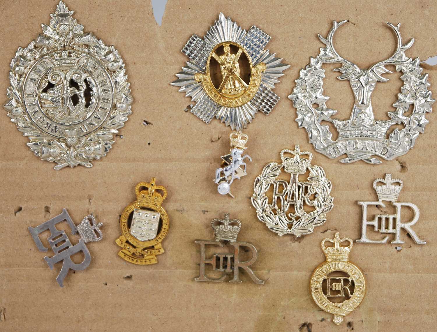 A small collection of cap and collar badges, to include Argyll and Sutherland Highlanders, Royal