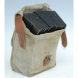 A WW II canvas and brown leather magazine pouch, containing five Bren gun magazines.