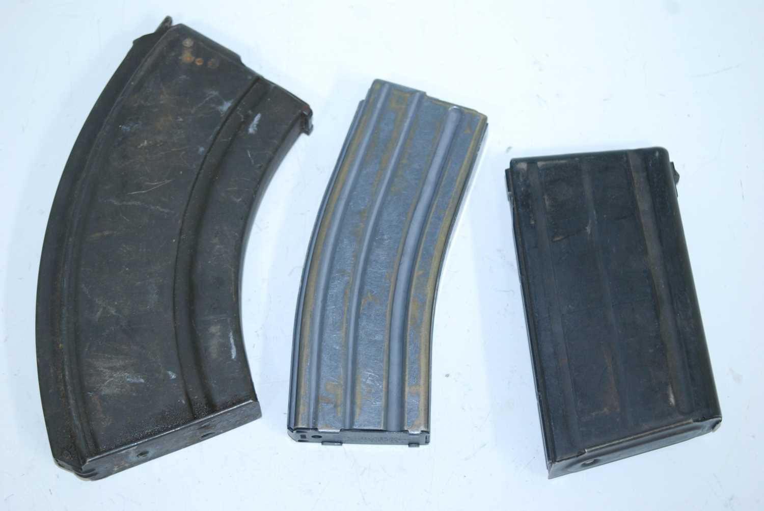 A Colt's Firearms Division 5.56 calibre magazine, together with a Bren magazine and one other. (3)