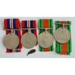 A collection of four WW II medals to include Defence x2 and War x2, together with a The Wakefield