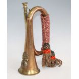 A copper and brass bugle with applied badge for the 23rd Royal Welsh Fusiliers, 31cm.