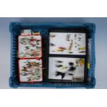 A collection of fishing tackle to include various wallets of flies, lures and floats etc.