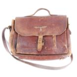 A German leather satchel, the front pouch with single pocket and pen compartment, the fold-over flap