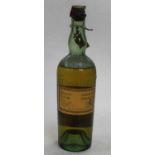A vintage bottle of Chartreuse green liqueur, circa 1956Seal to bottle is broken.Level low