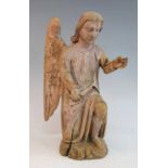 An 18th century carved pine figure of an angel, shown on one knee with arm outstretched, h.41cm Both