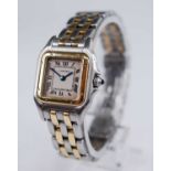 A lady's Cartier 18ct gold and steel Panthere wristwatch, having a signed silvered Roman dial,