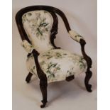 A Victorian floral carved mahogany showframe parlour tub chair, floral buttonback upholstered,