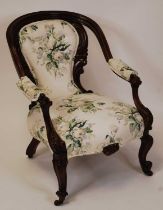 A Victorian floral carved mahogany showframe parlour tub chair, floral buttonback upholstered,