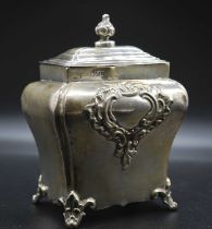 A late Victorian silver tea caddy, of shaped shouldered rectangular form with lift-off cover, having