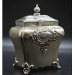 A late Victorian silver tea caddy, of shaped shouldered rectangular form with lift-off cover, having