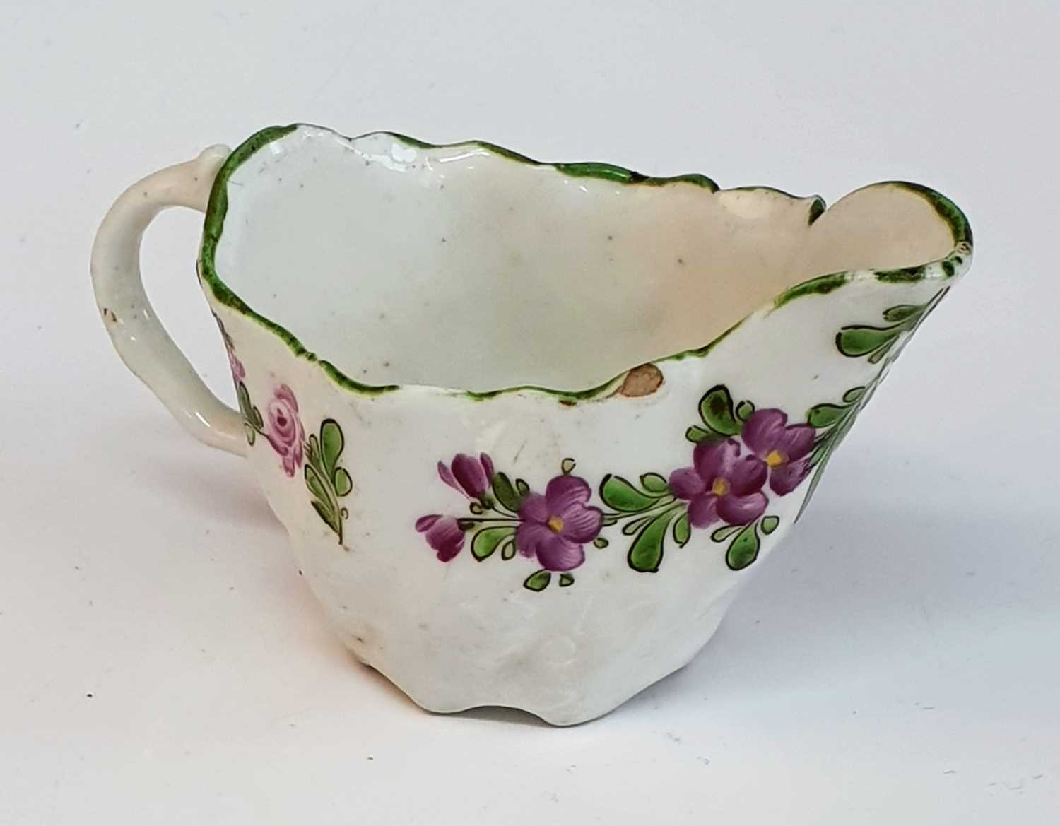 A circa 1780 Lowestoft porcelain 'Chelsea ewer' sauce boat, enamel decorated by 'The Tulip Painter',