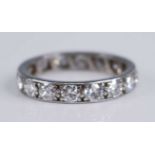 A white metal diamond full hoop eternity ring, grain set with 16 round brilliant cut diamonds,