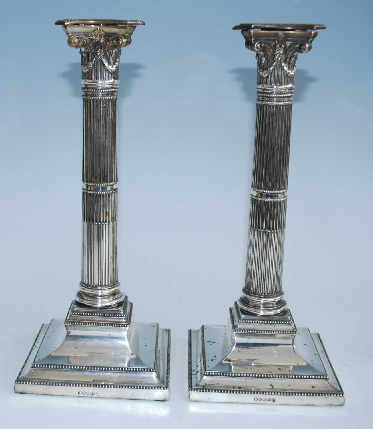 Two pairs of 19th century silver plated candlesticks, each stop fluted column standing upon beaded - Image 2 of 12