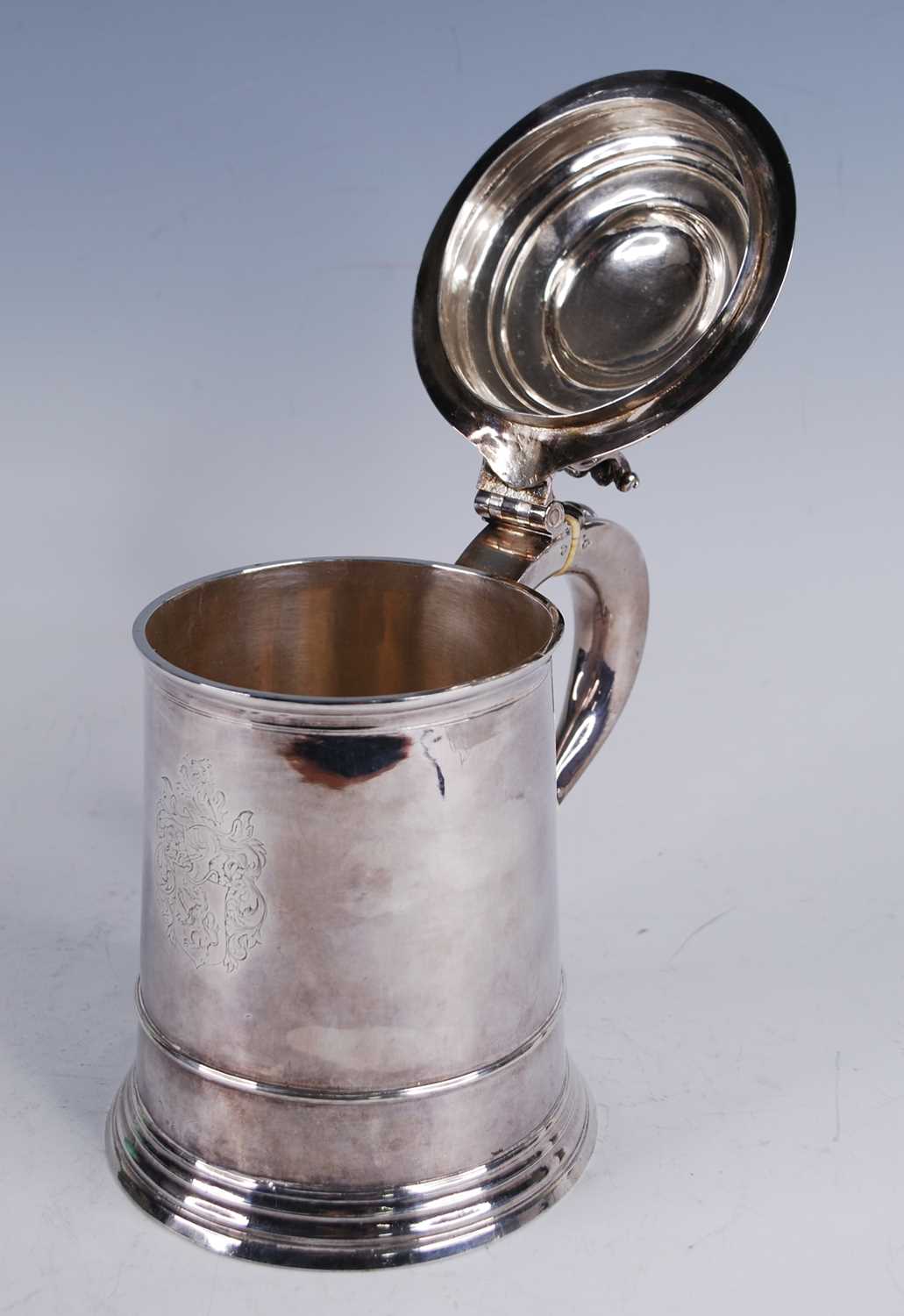 A George I silver lidded tankard, of flaring cylindrical form, the domed cover with scroll - Image 9 of 10