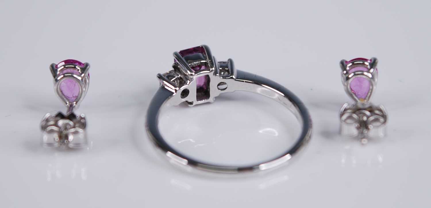 An 18ct white gold, pink sapphire and diamond three stone ring, the four-claw set emerald cut pink - Image 3 of 3