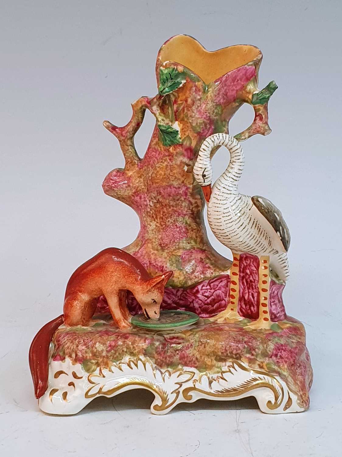 A circa 1840 Staffordshire spill holder, probably Dudson, in the form of a fox and a swan signifying