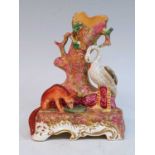 A circa 1840 Staffordshire spill holder, probably Dudson, in the form of a fox and a swan signifying