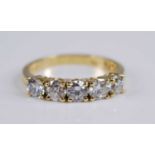 An 18ct yellow gold diamond five stone half hoop eternity ring, featuring five round brilliant cut