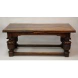 An antique oak drawleaf refectory table in the Elizabethan style, the three-plank top with cleated