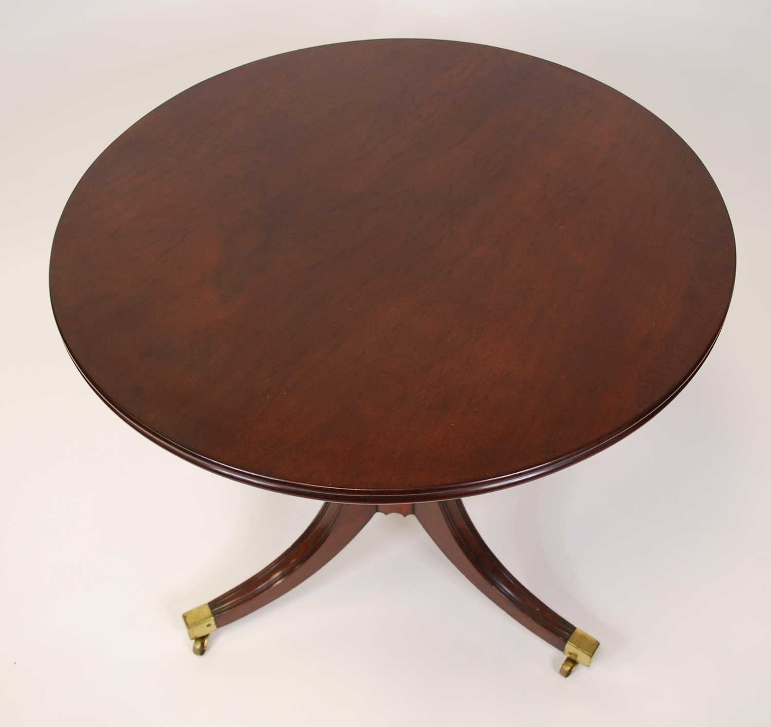 A Regency plum pudding mahogany circular tilt-top pedestal tripod table, raised on ring turned - Image 4 of 4