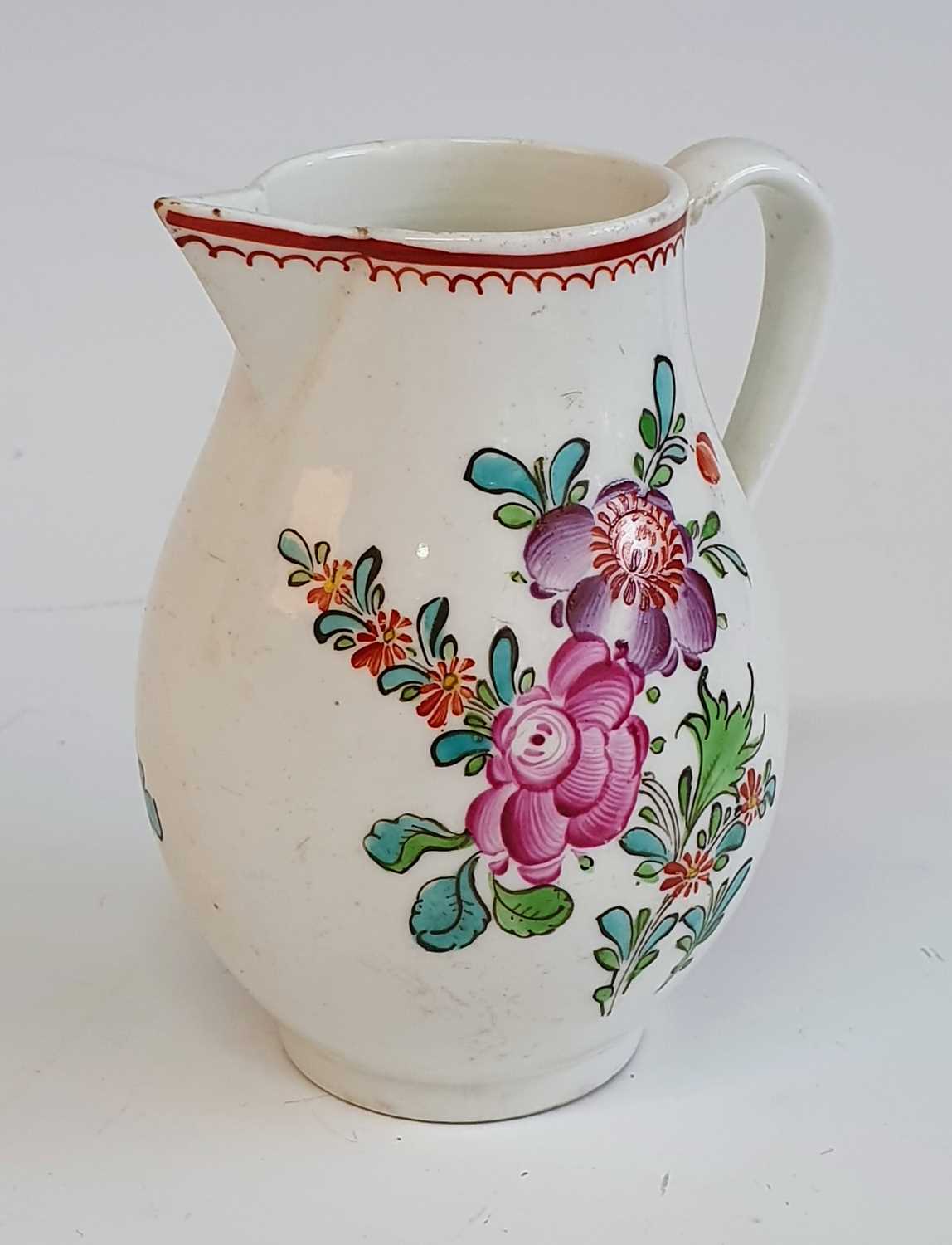 A circa 1780 Lowestoft porcelain sparrowbeak jug, enamel decorated with floral sprays, h.9cm A