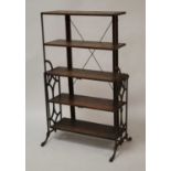 An early 20th century French oak and wrought iron metamorphic boulangerie rack, having five open