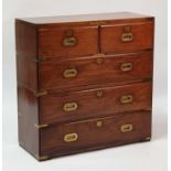 A late 19th century brass bound teak campaign chest, of two short and three long drawers, with brass