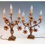 A pair of 19th century gilt metal three branch table candelabra, each in the form of a vase