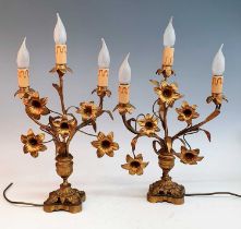 A pair of 19th century gilt metal three branch table candelabra, each in the form of a vase