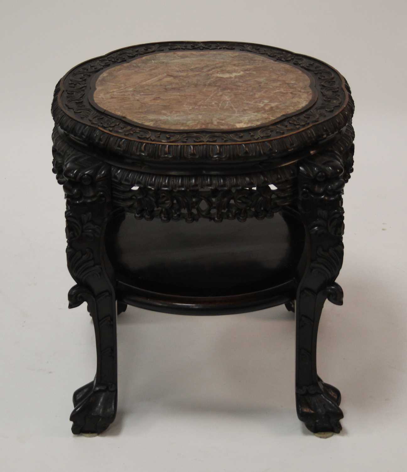 A circa 1900 Chinese 'rosewood' and rouge marble inset large urn stand, having a lobed top, all-over