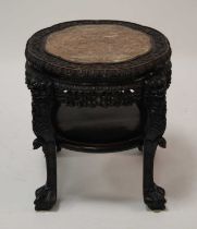 A circa 1900 Chinese 'rosewood' and rouge marble inset large urn stand, having a lobed top, all-over