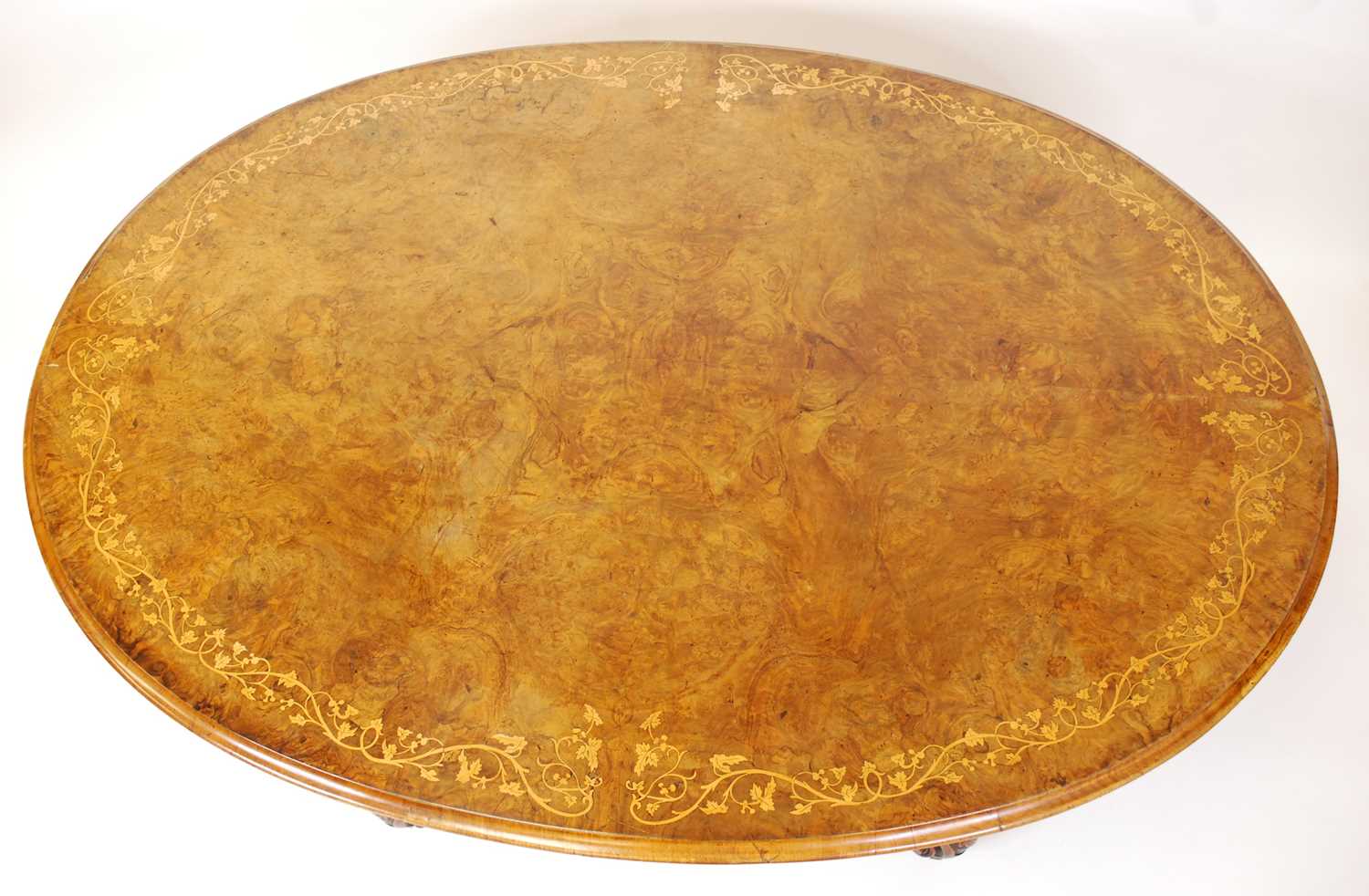 A mid-Victorian figured walnut and floral satinwood inlaid oval pedestal tilt-top breakfast table, - Bild 2 aus 3