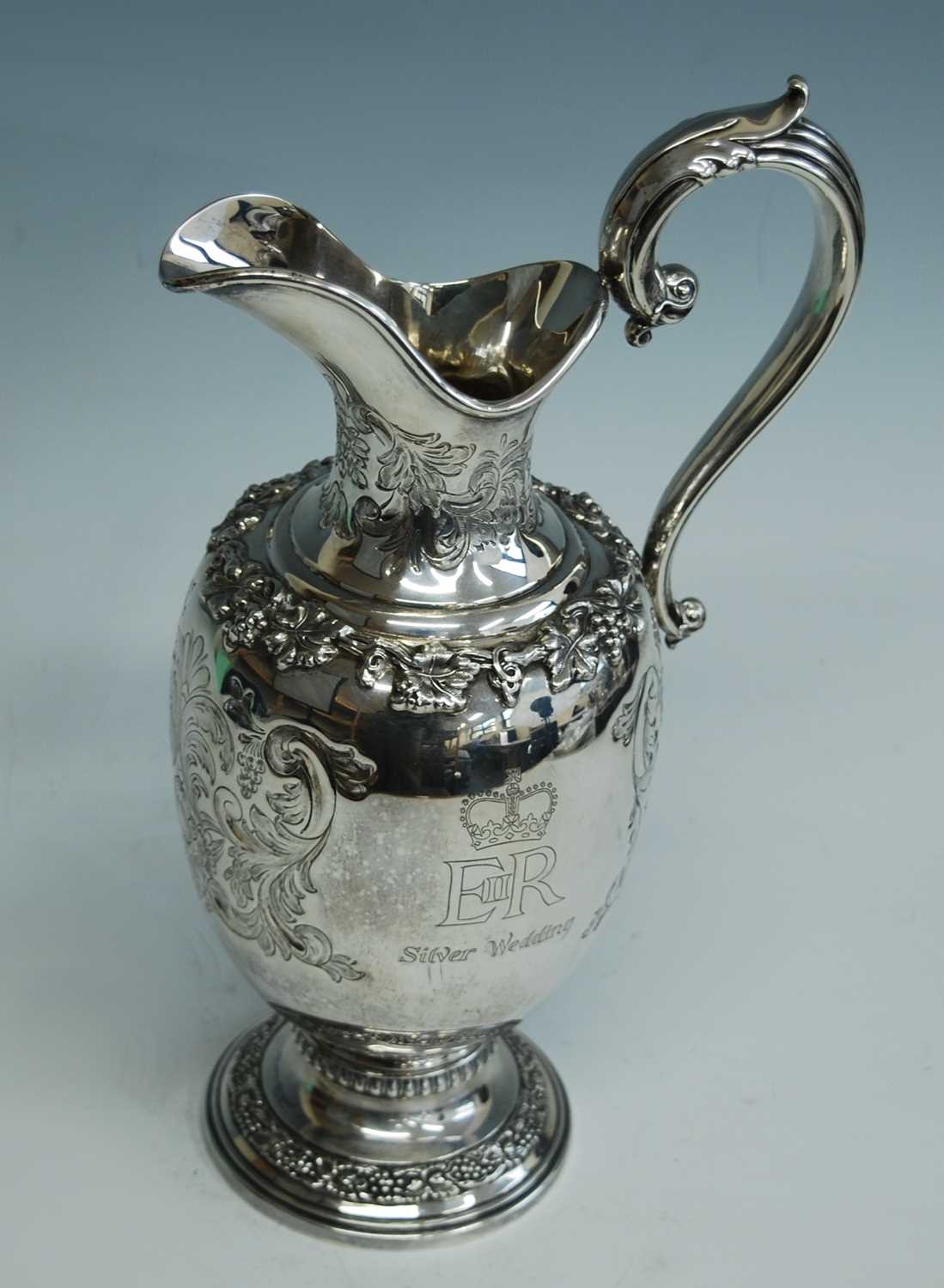 A Garrard & Co silver commemorative wine ewer for the Silver Wedding anniversary of Queen