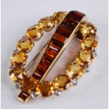 A yellow metal signed Cartier London citrine, topaz and diamond clip brooch, comprising a central