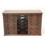 A late Victorian rosewood table-top bank of drawers, having twin flights of six graduated drawers