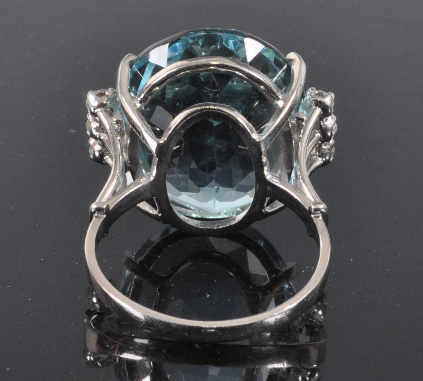 A white metal, aquamarine and diamond ring, comprising a centre oval aquamarine in a four claw - Image 3 of 7