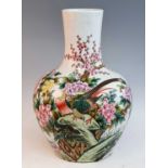 A 20th century Chinese porcelain tianqiuping vase, enamel decorated with a peahen amongst