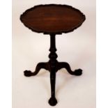 A 19th century mahogany pedestal tripod low occasional table, in the manner of Thomas Chippendale,