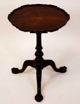 A 19th century mahogany pedestal tripod low occasional table, in the manner of Thomas Chippendale,