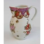 A circa 1780 Lowestoft porcelain sparrowbeak jug, enamel decorated with floral sprays below a diaper