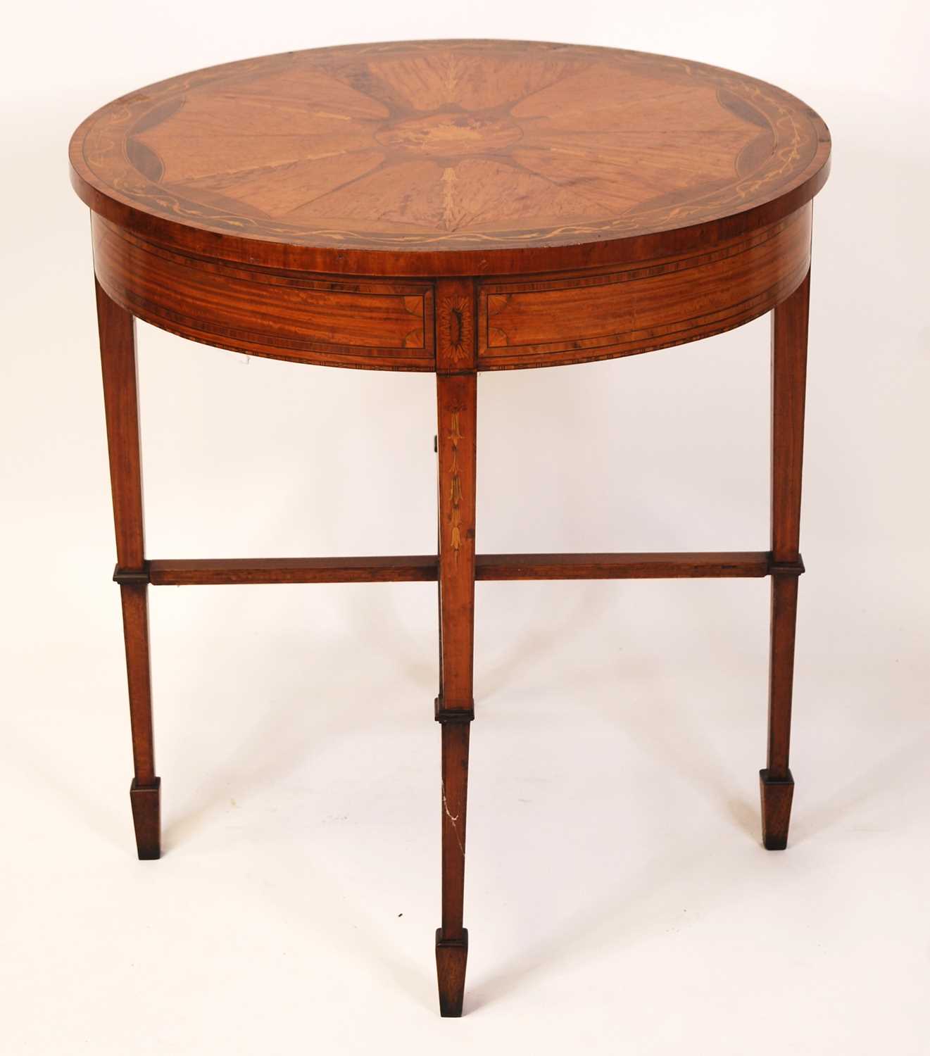 A circa 1900 French satinwood circular centre table, having radial veneers, rosewood crossbanding