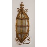 A Regency giltwood corner mirrored three-tier wall shelf, wall mounted with intricate gilt gesso