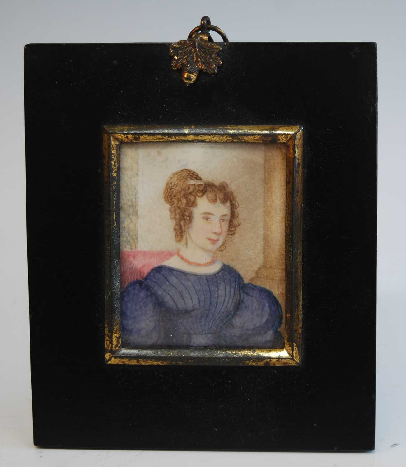 Mid-19th century English school - half-length portrait of a young woman wearing a blue dress and