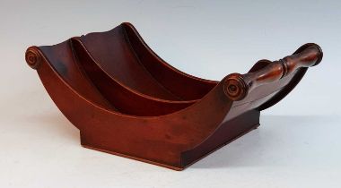 A George III mahogany cheese coaster, of typical curved form, having turned roundels to each end,